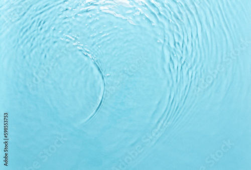 Background with water  waves on the water in the pool during the day  cosmetic moisturizer emulsion