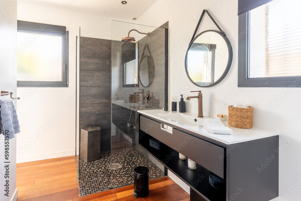 Home bathroom, bright new bathroom interior with tiled glass shower, vanity cabinet, black and white designed interior Home bathroom, bright new bathroom interior with tiled glass shower, vanity cabinet, black and white designed interior