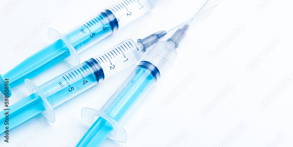Disposable plastic syringe prepared for injection and vaccination in the hospital. The concept of medicine and health Disposable plastic syringe prepared for injection and vaccination in the hospital. The concept of medicine and health
