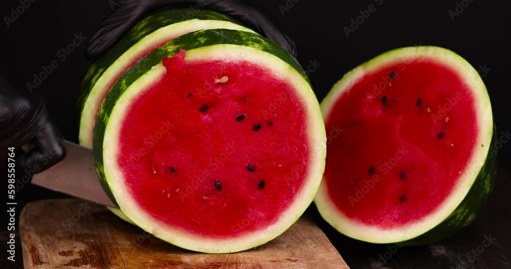 Ripe red watermelon with black seeds, ripe and sweet red watermelon cut into pieces Ripe red watermelon with black seeds, ripe and sweet red watermelon cut into pieces