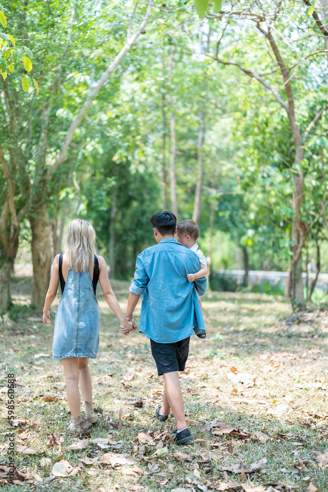 Family enjoying a camping holiday in the countryside ,Camping, travel, tourism, hiking and people. Concept - Happy family with backpacks and thermos at camp.