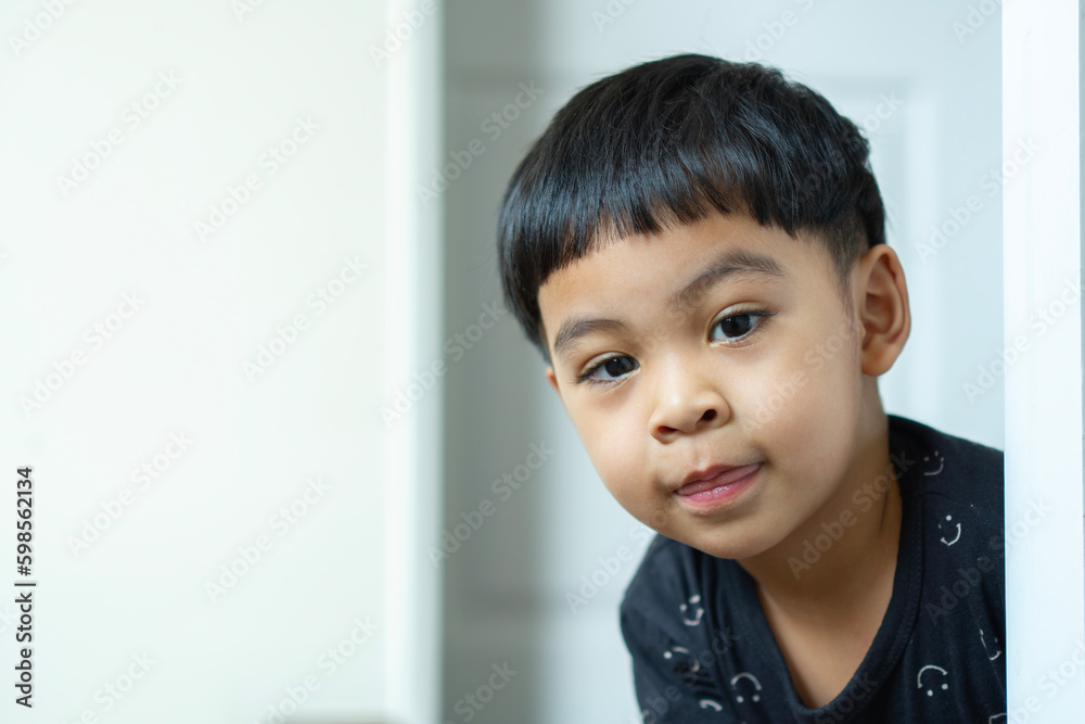 Portrait of happy Asian boy looking at camera and smiling Portrait of happy Asian boy looking at camera and smiling