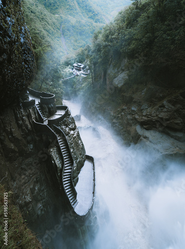 The majestic Pailon Del Diablo in Ecuador. Beautiful waterfall with beautiful stairs. photo