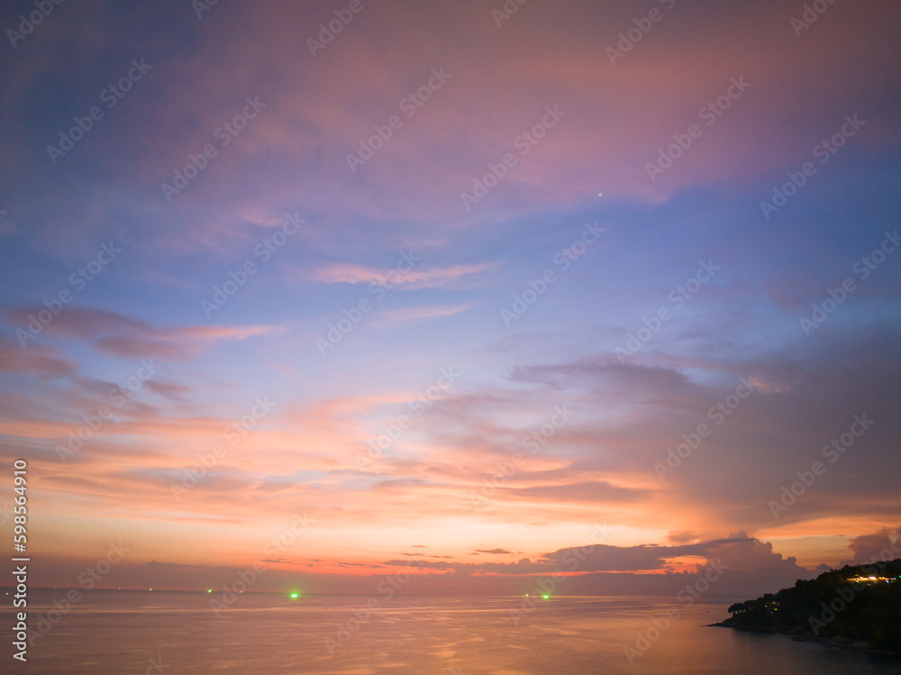 aerial view amazing sky in sunset above the ocean at Karon beach Phuket..Imagine a fantasy bright yellow clouds changing in colorful sky..Gradient color. Sky texture, abstract nature background..