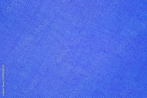 Background of blue fabric close-up, uniform texture