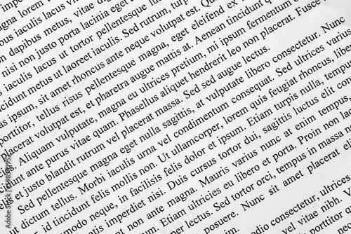 Lorem Ipsum text printed on white paper close-up diagonally, example document
