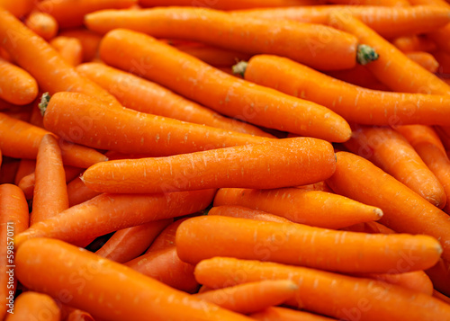 Carrots peeled, in bulk, on supermarket, selective focus
