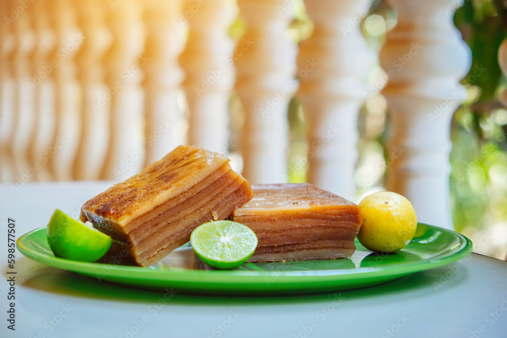 Bebinka is a traditional dessert from Goa, India. Layered cake of 10 layers according to the recipe of Portuguese monastery sweets and Goa cuisine. Sweet pudding based on coconut milk and flour - obrazy, fototapety, plakaty 