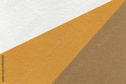 Texture of old craft white, brown and beige color paper background, macro. Vintage abstract ocher cardboard