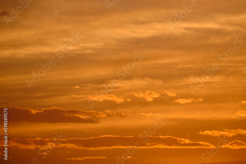 Clouds yellow sky background during sunset. © freeman83