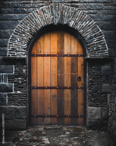 Old Castle Wooden Arch Door and Stone Wall