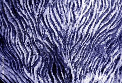 Metal rough surface with blur effect in blue tone.