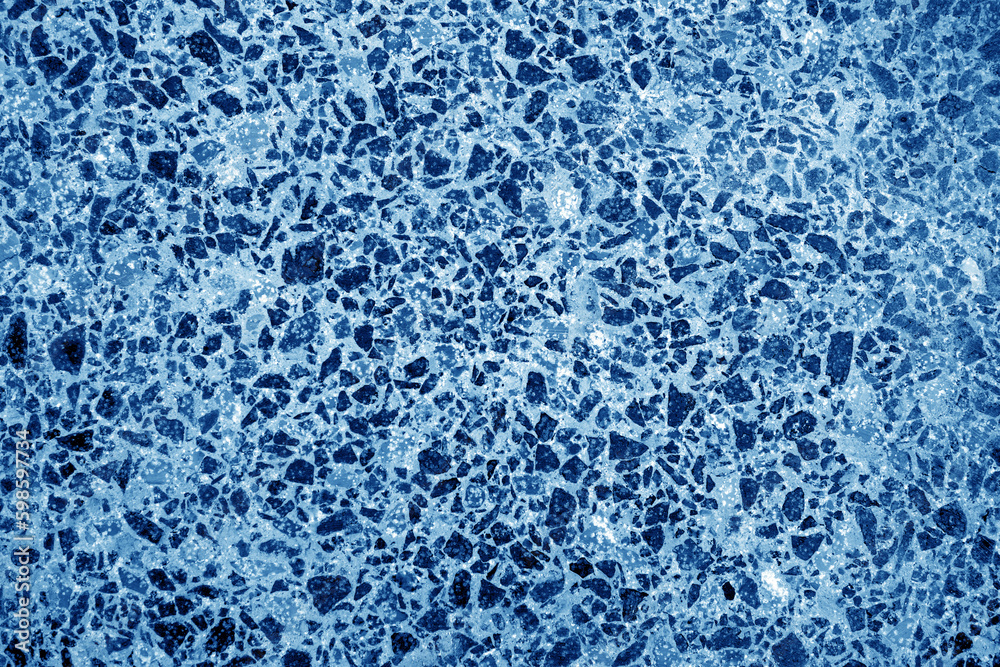 Cement with gravel stones surface in navy blue tone. Cement with gravel stones surface in navy blue tone.