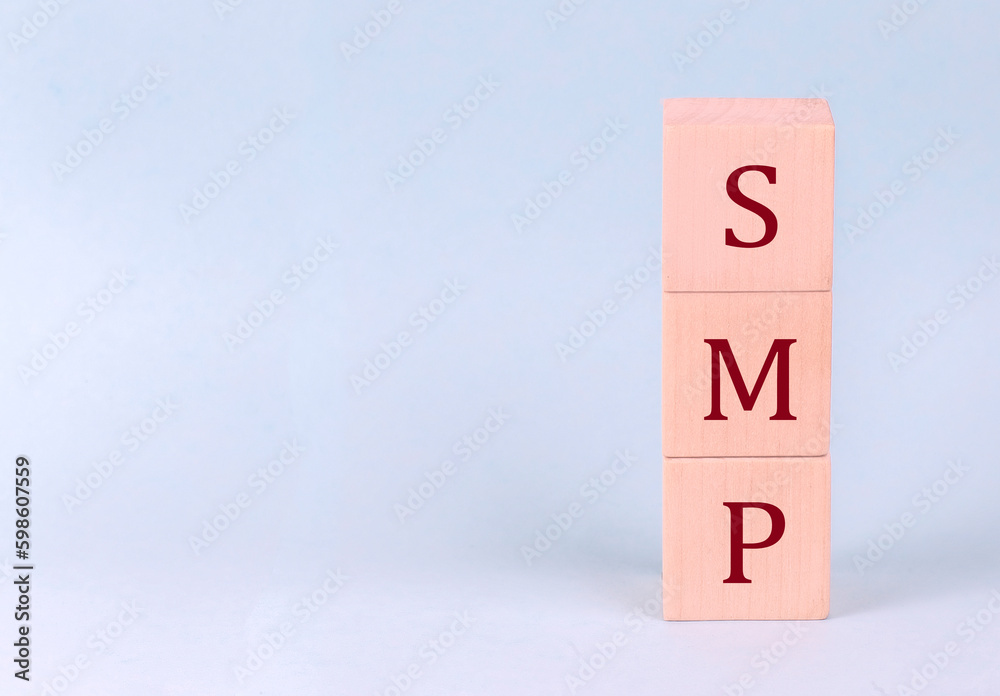 SMP on wooden cubes on a blue background SMP on wooden cubes on a blue background