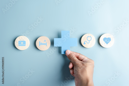 Health insurance and medical welfare concept. people hands holding plus symbol and healthcare medical icon, health and access healthcare. photo