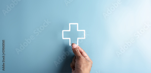 Health insurance and medical welfare concept. people hands holding plus symbol and healthcare medical, health and access healthcare.