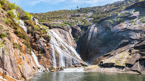 Dumbria, Galicia, Spain - April 5, 2023: Fervenza de Ezaro (Ezaro Waterfall)