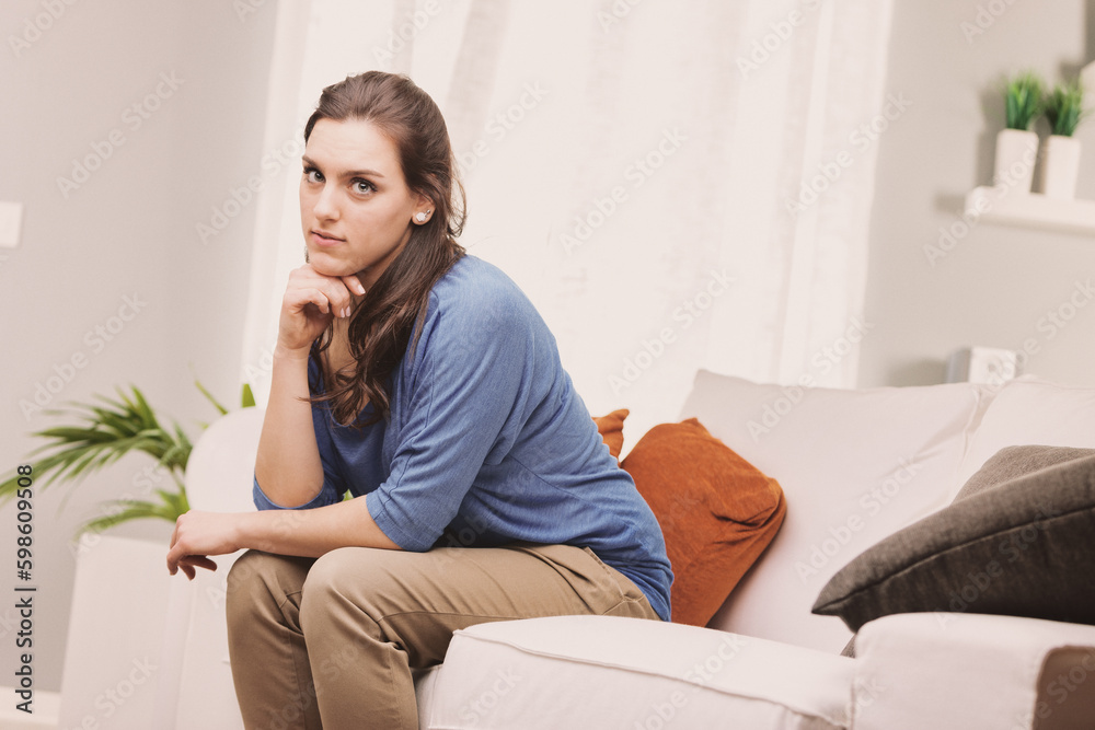 Independent, self-sufficient woman on sofa Independent, self-sufficient woman on sofa