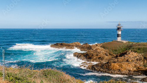 Ribadeo, Galicia, Spain - Abril 2, 2023: Ribadeo lighthouse in Illa Pancha (Pancha Island)