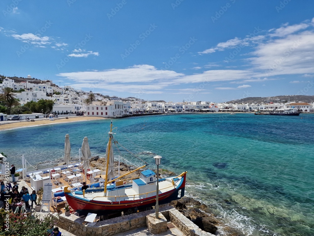 Landscape views of buildings and boats in mykonos