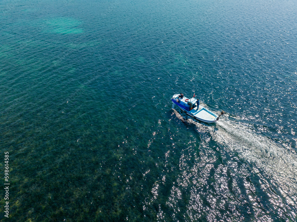 Turkey Pissa bay, fishing boat in the turquoise sea.