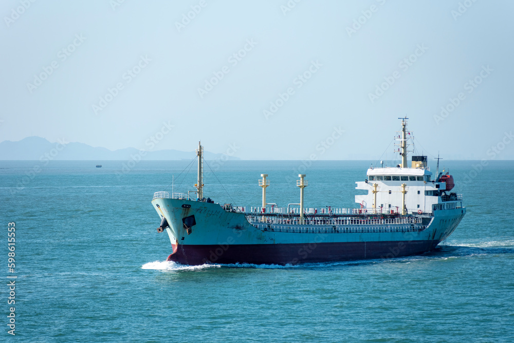 Cargo ship sailing near Chinese sea coast in the vicinity of Macau and Hong Kong. 