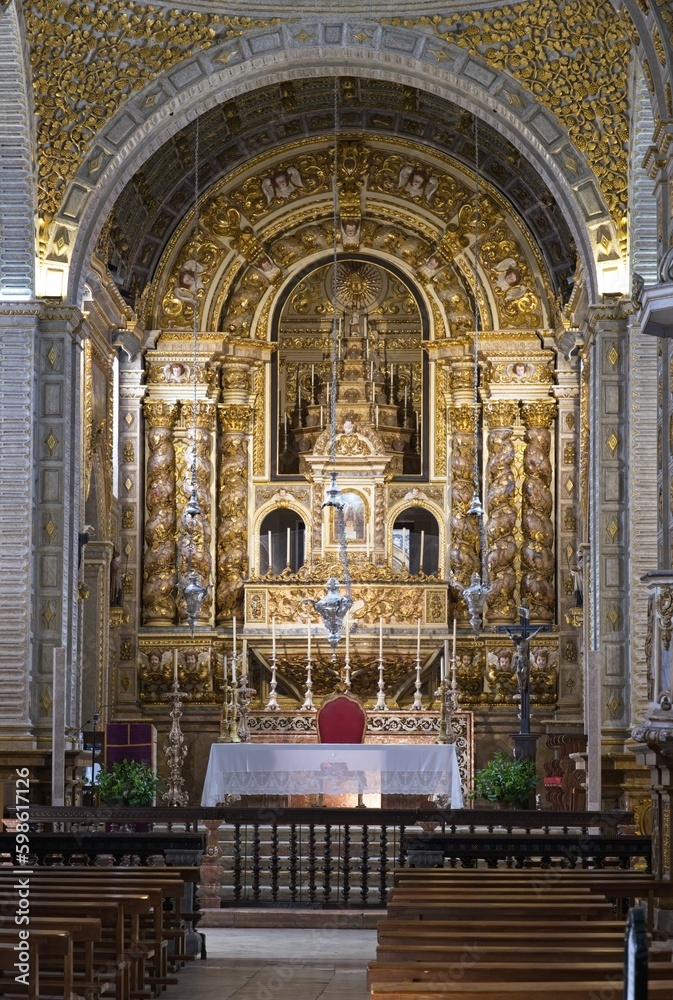 Fototapeta premium Nazare, Portugal - March 28, 2023: The Sanctuary of Nazare (Santuario de Nossa Senhora da Nazare) is located on the hilltop called O Sitio. 14th century. Sunny spring day. Selective focus