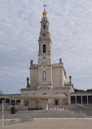 Fatima, Portugal - March 29, 2023: The Sanctuary of Fatima (or Sanctuary of Our Lady of the Rosary of Fatima) is a Marian shrine dedicated to Our Lady of Fatima. Sunny spring day. Selective focus