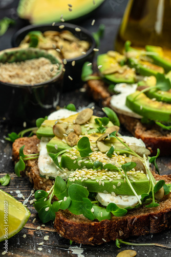 avocado toasts with rye bread, Delicious breakfast or snack, Clean eating, dieting, vegan food concept. top view