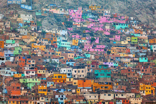Colorful slums on the hill of San Cristobal in the center of Lima. Peru © yurybirukov