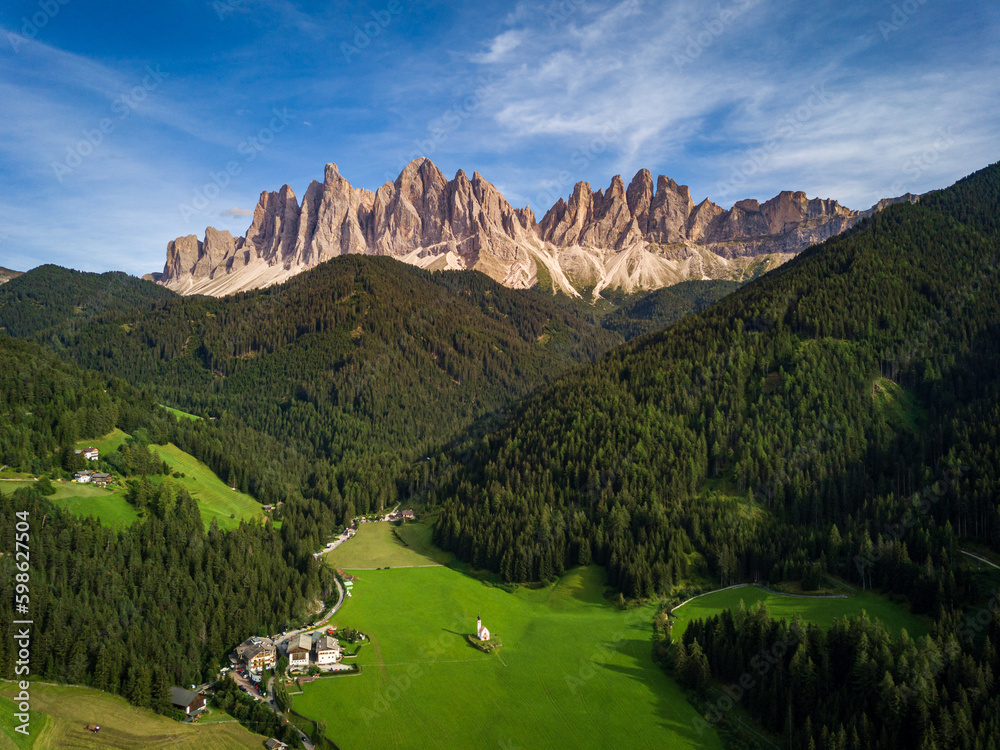 panoramic view of the dolomites in val di funes, the Odle with the village of Santa Maddalena below, Italy