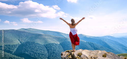 Young woman on the top of mountain © nickolya