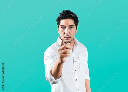 Fotografie Asian model pointing finger at camera showing seriousness on isolated background