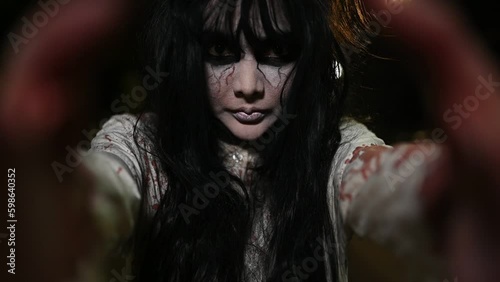 Horror woman concept,Ghost on the road in the city,A vengeful spirit on the street of the town,Halloween festival,Make up ghost face
