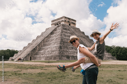 Family vacations, mother and daughter together, pyramid in Chichen Itza, Yucatan, Mexico