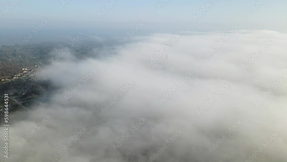 4K Aerial Drone Timelapse above foggy clouds against blue sky. Over Residential Area. Reversible Clip. 4K Aerial Drone Timelapse above foggy clouds against blue sky. Over Residential Area. Reversible Clip.