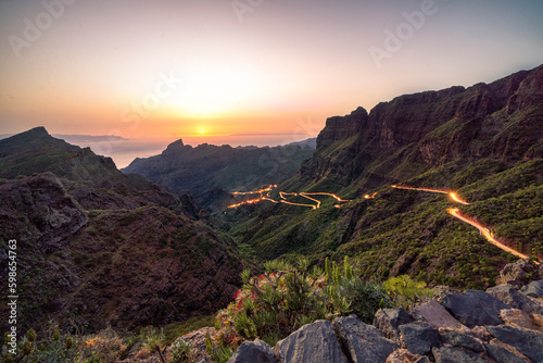 Golden hour sunset image of winding road leading to the village of Masca in dramatic landscape on Tenerife, Spain © Donald
