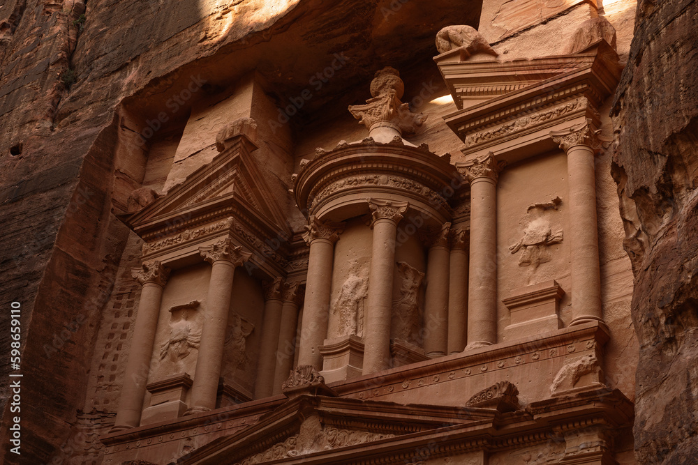 Ancient monument the Treasury in the ancient city of Petra carved in the sandstone on a sunny day