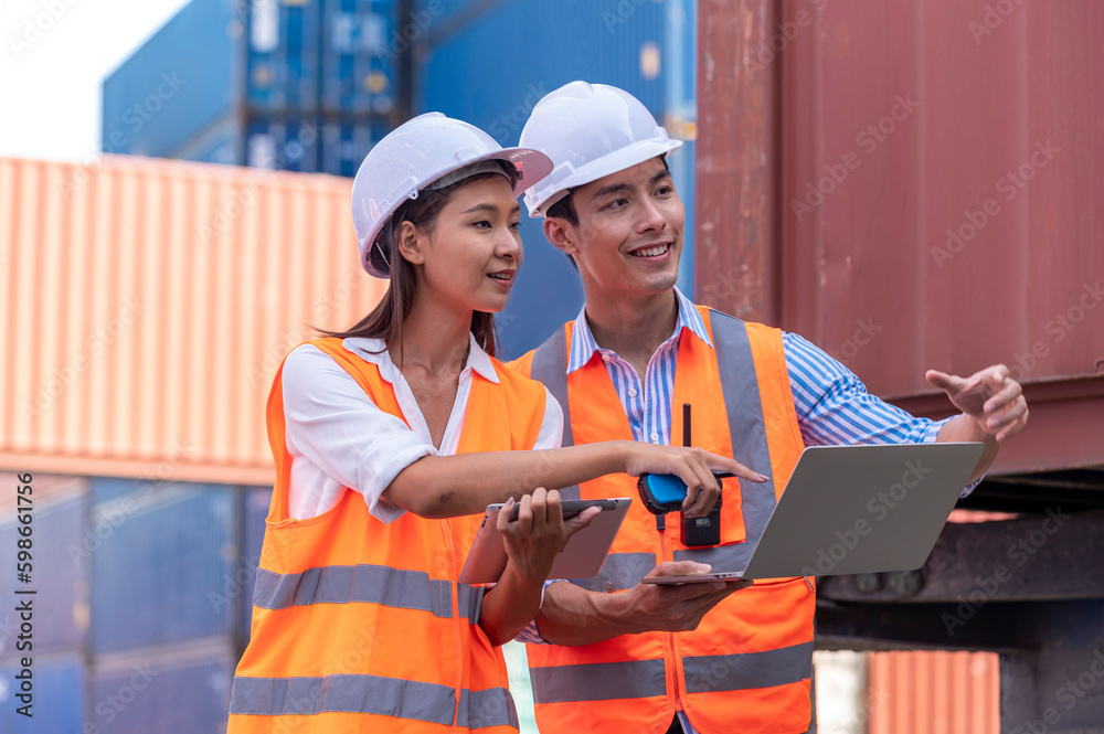 Happy man and woman Asian dock control working and talking with smile around Shipping container stacker in commercial transport port