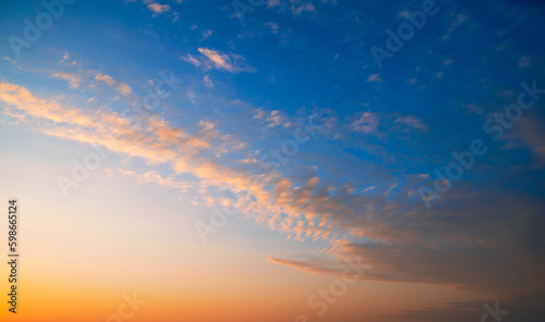 Real amazing sunset sky with gentle colorful clouds
