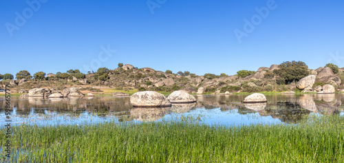 Panoramic photograph of a lagoon in the Natural Reserve of Los Barruecos, Malpartida de Cáceres, Spain photo