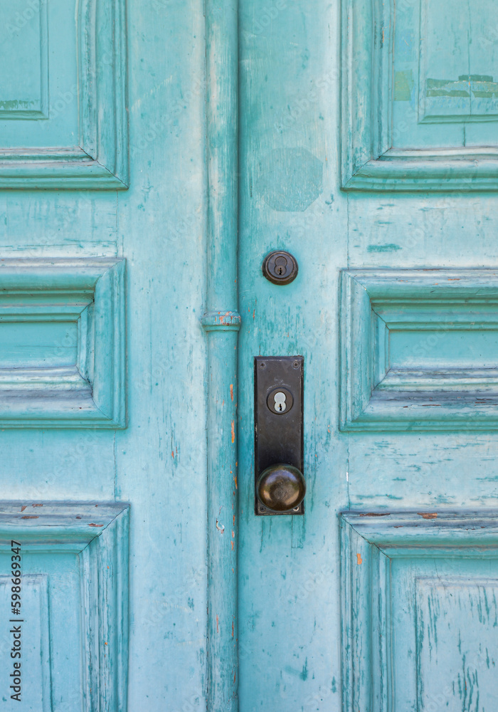 Closeup of old textured blue door on abandoned building Closeup of old textured blue door on abandoned building