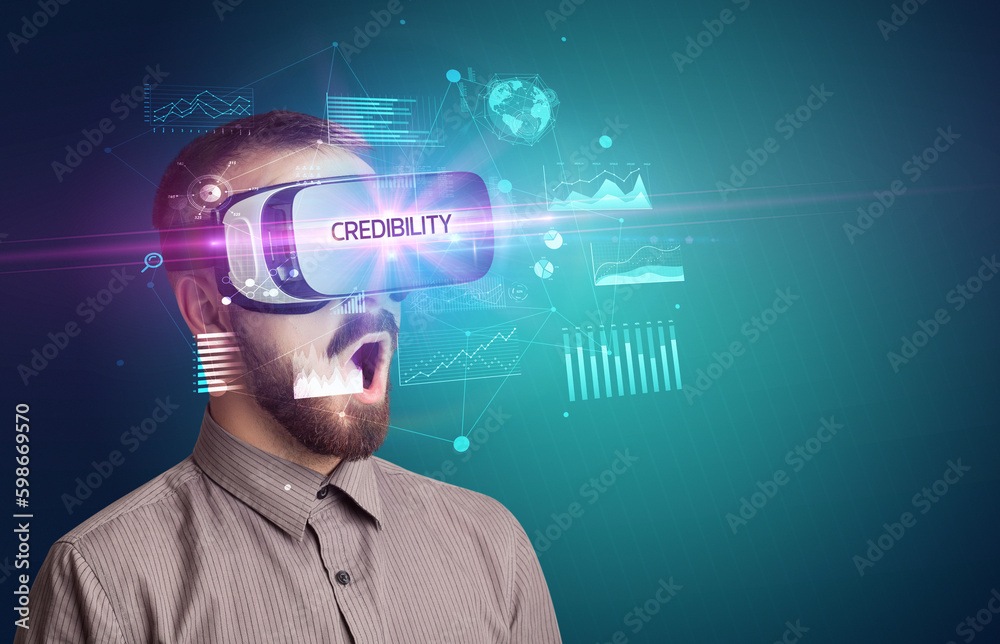 Businessman looking through Virtual Reality glasses Businessman looking through Virtual Reality glasses