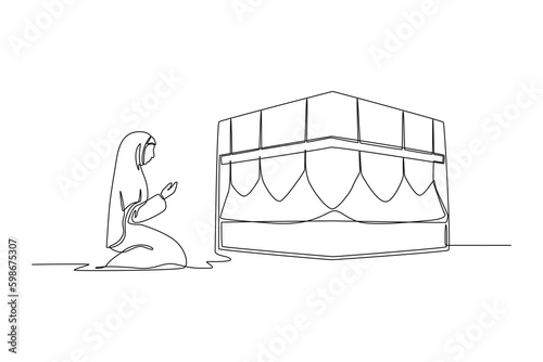 Continuous one line drawing muslimah wearing white traditional clothes pray on kaabah. Hajj and umrah concept. Single line draw design vector graphic illustration.