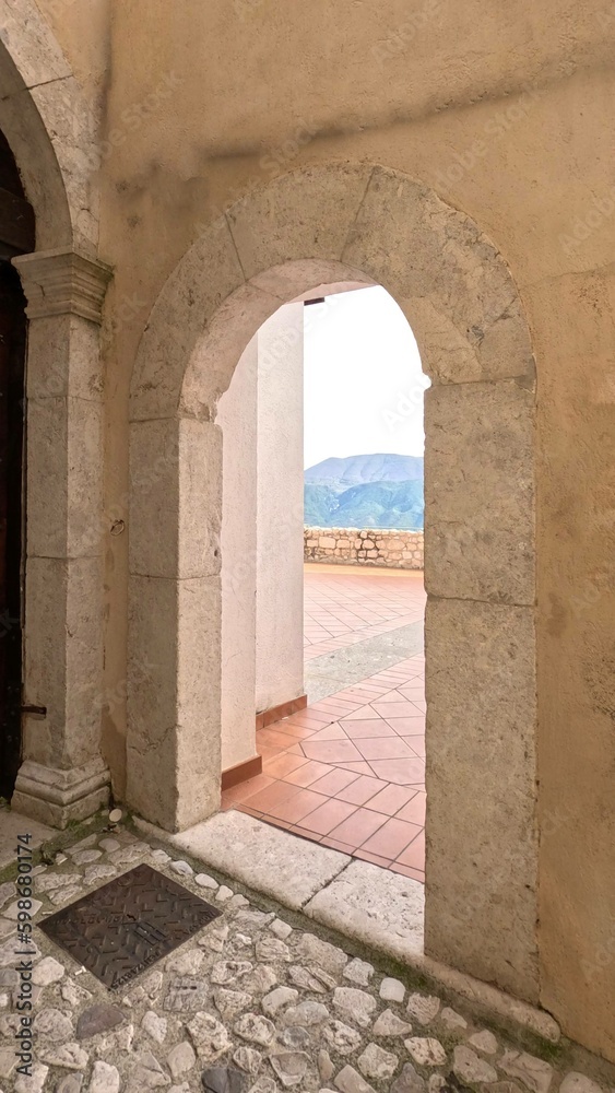 Naklejka premium An entrance arch to a panoramic terrace in Guardia Sanframondi, an ancient town in the province of Benevento, Italy.
