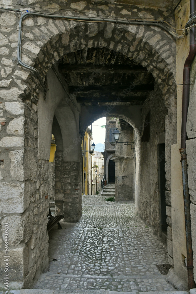 A narrow street among the old houses of Guardia Sanframondi, a small town of Benevento province, Italy.