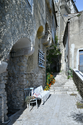 A narrow street among the old houses of Guardia Sanframondi, a small town of Benevento province, Italy. photo