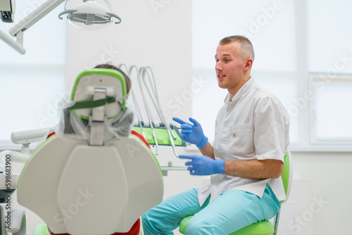 the patient at the dentist s appointment complains of toothache and caries the doctor advises her before the examination