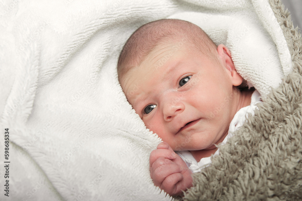 Newborn looking close up. Baby care concept Newborn looking close up. Baby care concept