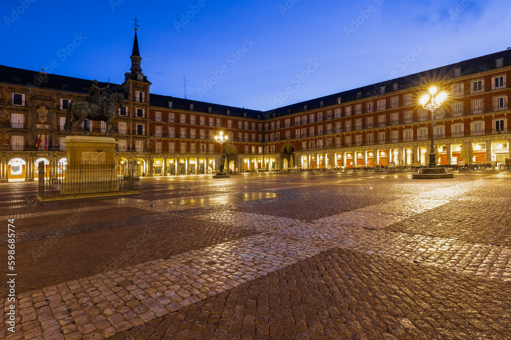 Madrid, Spain 08-06-2021 the beautiful and vibrant plaza mayor in the heart of Madrid during blue hour. The place where you can experience the real Spanish culture and to enjoy a typical bocadillo